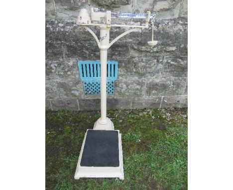A set of Harrods platform scales, with weights, height 37ins