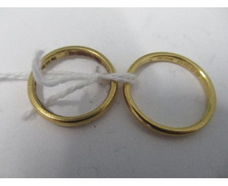 A plain 22 carat gold wedding ring, together with another similar, 6.5g gross