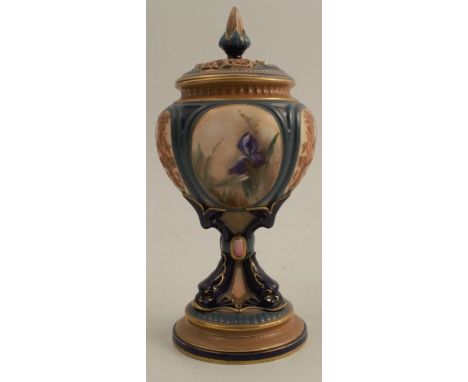 A Hadleys Worcester quarter lobed pedestal vase, decorated with sepia panels of flowers, having dolphin feet, raised on a cir