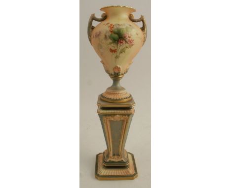 A Royal Worcester vase, the pedestal twin handled blush ivory vase decorated with thistles and flowers, mounted on a column, 