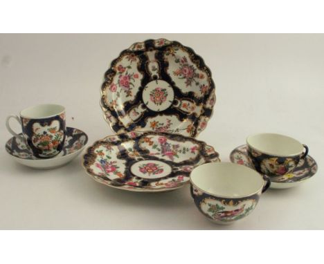 A collection of First Period Worcester porcelain, all decorated with a scale blue ground and reserves of either fabulous bird