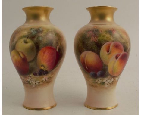 A pair of Royal Worcester vases, decorated with hand painted fruit to a mossy ground by Ricketts, height 6.5ins - Both are in