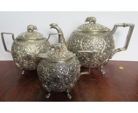 A 19th Century three piece Indian silver tea service, no marks, weight 31oz all in - The base of the teapot is a bit dented. 