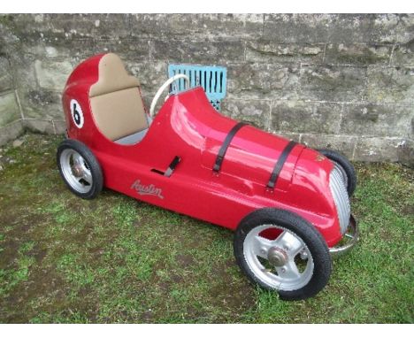 A red swing pedal car, “Austin Pathfinder”, with bonnet opening to reveal dummy engine, with real spark plugs, marked "6", Si