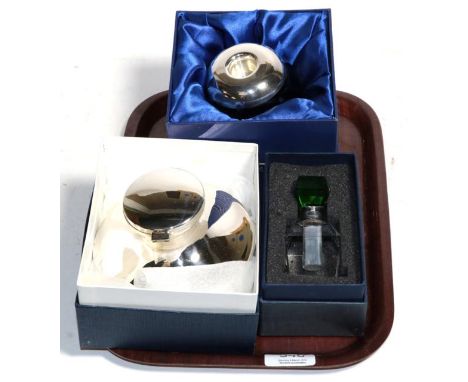 A silver capstan inkwell, Birmingham 2003; a silver mounted Isle of Wight glass candlestick, Birmingham 2009, signed to base;