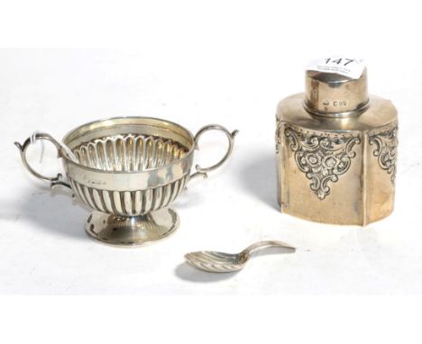 A silver tea caddy, Sibray, Hall &amp; Co., London 1894, a silver twin handled pedestal cup with part gadrooned body (marks r