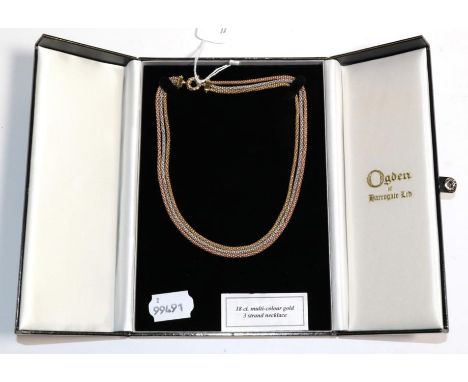 An 18 carat three colour gold rope necklace, length 41cm, in an Ogdens of Harrogate box .  Gross weight - 26.16 grams. 