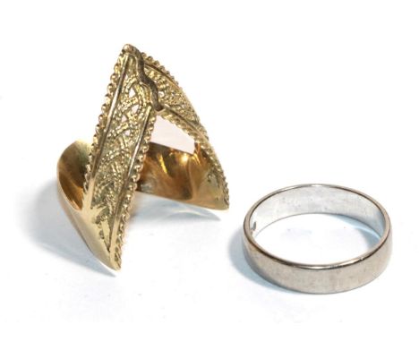 A platinum band ring, finger size K; and a Middle Eastern yellow metal ring, finger size N (2).  Platinum band ring - 3.14 gr