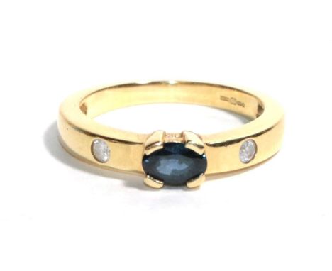 An 18 carat gold sapphire and diamond ring, finger size L1/2.  Gross weight - 4.09 grams. 