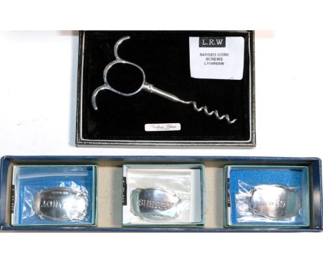 A modern cast silver corkscrew after a 19th century example, Sheffield 2014; and three silver decanter labels, all as new 