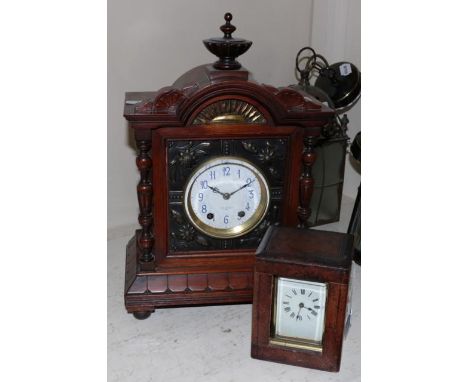 A walnut cased striking mantle clock with floral embossed front and side panels retailed by J.W. Benson, 25 Old Bond St, Lond