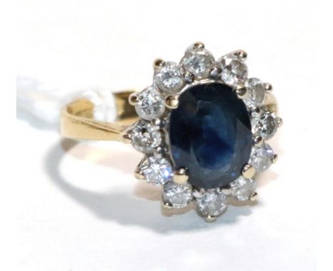 An 18 carat gold sapphire and diamond cluster ring, finger size J . Gross weight - 3.79 grams. 