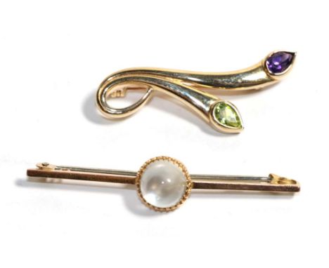 A moonstone brooch, stamped '9ct', length 5cm; a 9 carat gold amethyst and peridot brooch, length 3.75cm (2).  Gross weight -