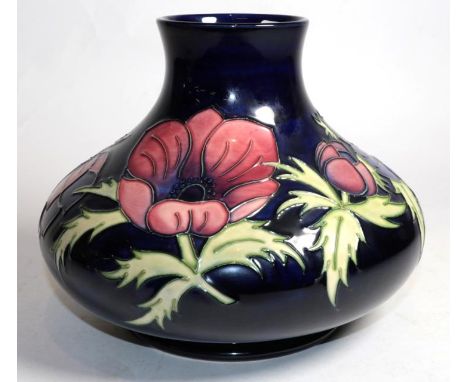 A Moorcroft pottery Anemone pattern vase, painted and impressed marks, also gold signature for John Moorcroft, and dated 15.1