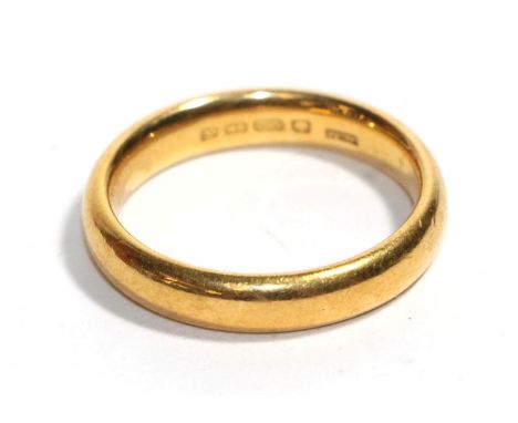 A 22 carat gold band ring, finger size O.  Gross weight - 7.22 grams. 