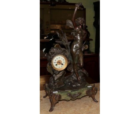 A spelter figural striking mantel clock 
