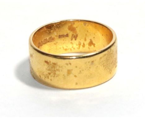 A 22 carat gold band ring, finger size L1/2.  Gross weight - 7.14 grams