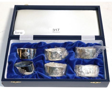 A set of six Scottish silver napkin rings, Edinburgh 1997, with Celtic design, as new boxed, 5.8ozt 