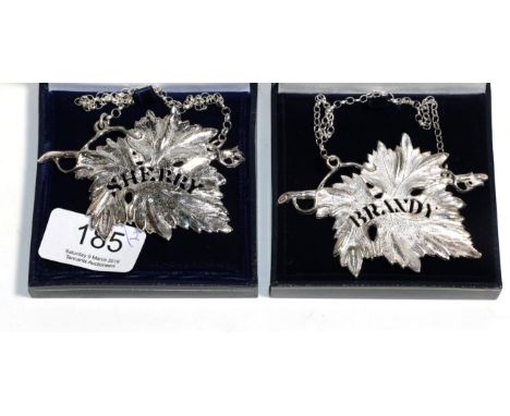 A pair of modern cast silver decanter labels, Birmingham 2003/06, modelled as a vine leaf and pierced ''Sherry'' and ''Brandy