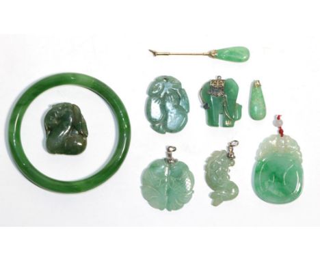 Six jade pendants of varying sizes (a.f.); a jade collar stud (a.f.) and a jade bangle, inner diameter 6.5cm  .  Gross weight
