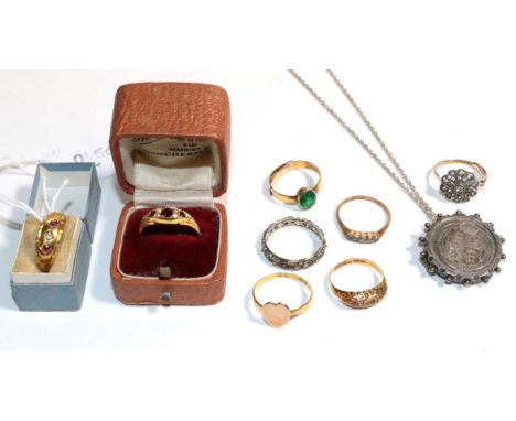 Seven assorted gem and paste set rings (four with re-sizing adjusters present) (a.f.) and a coin brooch/pendant on chain .  2