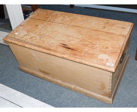 A Victorian pine blanket chest containing a small quantity of wood working tools