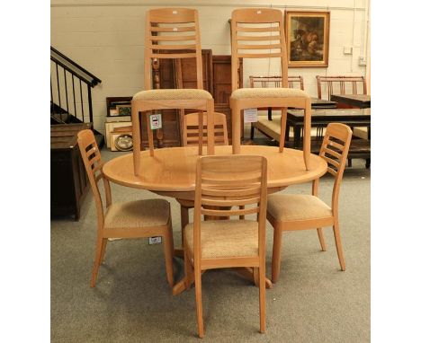 A Contemporary light oak drawer leaf kitchen table, 142cm by 104cm by 76cm (open) together with six ladder back chairs (7)