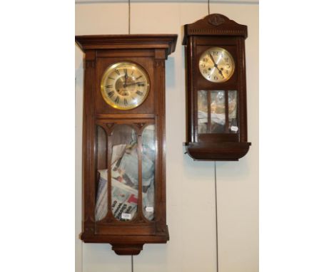 An Art Nouveau oak cased chiming wall clock retailed by J W Johnston &amp; Son, Barrow, another striking wall clock and a Art