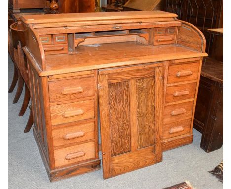 An early 20th century oak roll top desk, the escutcheon stamped LEBUS DESK, 122cm by 68cm by 102cm 