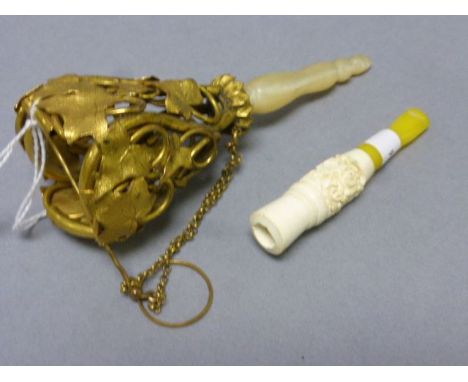 A cheroot holder and one other item
