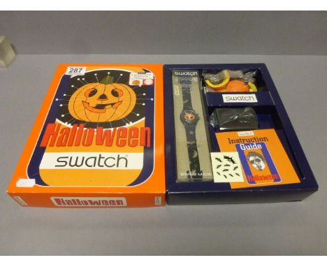 A boxed Halloween Swatch watch presentation 