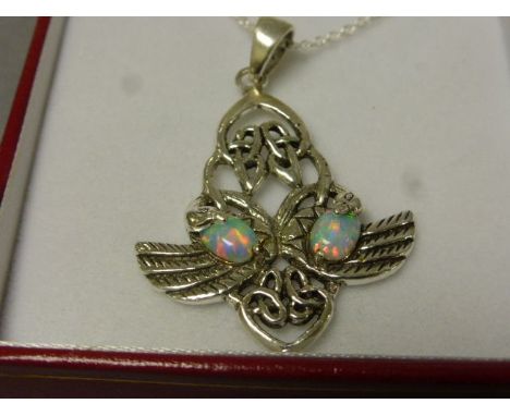 A silver and opal art nouveau style pendent necklace 