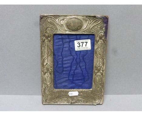 A Art Nouveau silver frame, with a stylised boarder  