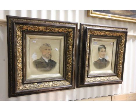 Pair of overpainted portrait photographs with ornate frames 