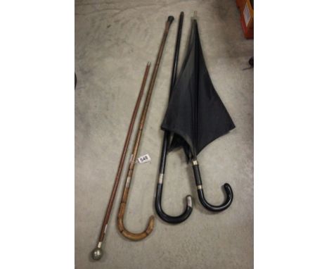 Two Walking Sticks with Silver Bands, Military Swagger Stick and Umbrella