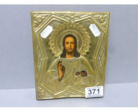 Painted religious icon with brass surround 