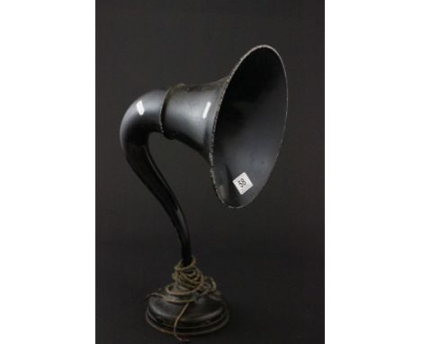 A vintage speaker in the shape of a car horn 
