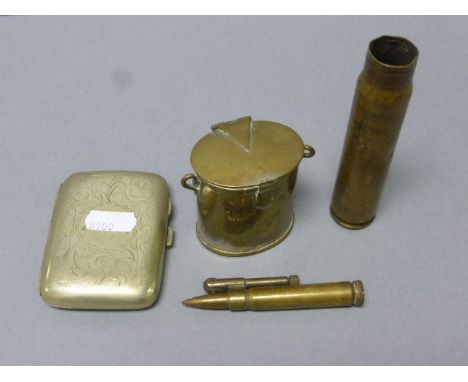 A small gun shell, along with a silver plated cigarette case, trench art lighter and match holder 