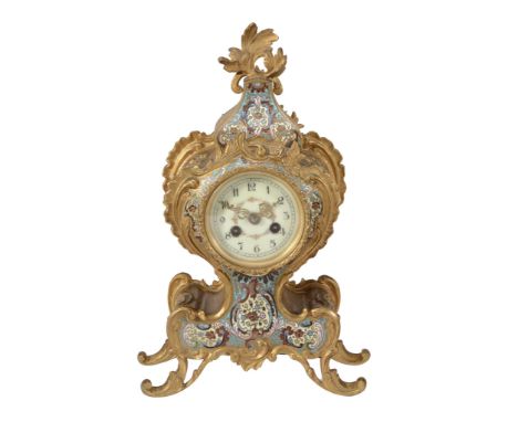 A French gilt brass and champleve enamelled mantel clock in the Louis XV...  A French gilt brass and champleve enamelled mant