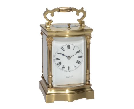 A French lacquered brass bowfronted carriage clock with push-button repeat...  A French lacquered brass bowfronted carriage c