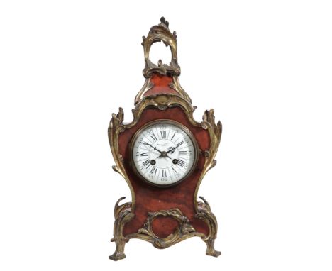 A French Louis XV style gilt brass mounted tortoishell mantel clock Retailed...  A French Louis XV style gilt brass mounted t