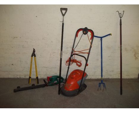AN ELECTRIC FLYMO MOWER, A HEDGE TRIMMER AND SOME GARDEN TOOLS