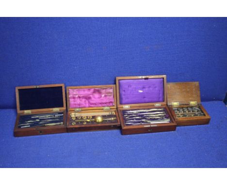 TWO CASED COMPASS SETS TOGETHER WITH A CASED HYDROMETER AND A PART CASED STAMP SET