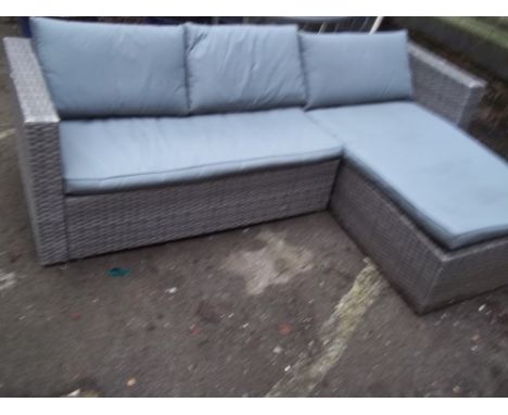 A GARDEN FURNITURE RATTAN CORNER SOFA