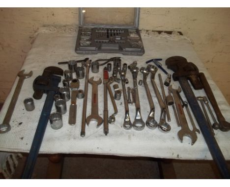 A SELECTION OF TOOLS TO INCLUDE SPANNERS, DRILL BITS AND A 36 INCH PAIR OF STILSONS