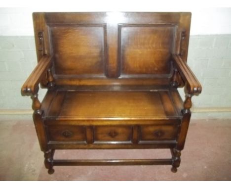 AN OAK MONKS BENCH