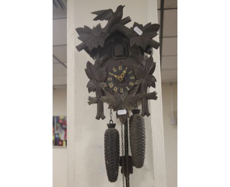 A CARVED WOOD CUCKOO CLOCK A/F