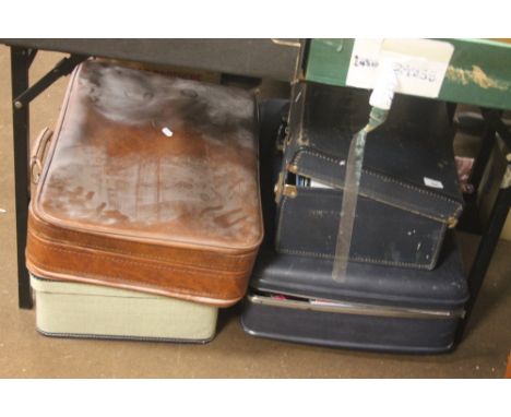 FOUR VINTAGE SUITCASES 