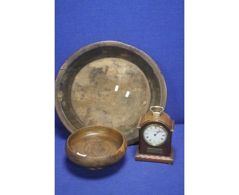 A LARGE ANTIQUE WOODEN BOWL TOGETHER WITH A SMALLER WOODEN BOWL AND A CLOCK