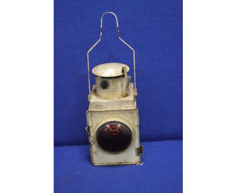 AN ANTIQUE RAILWAY LAMP